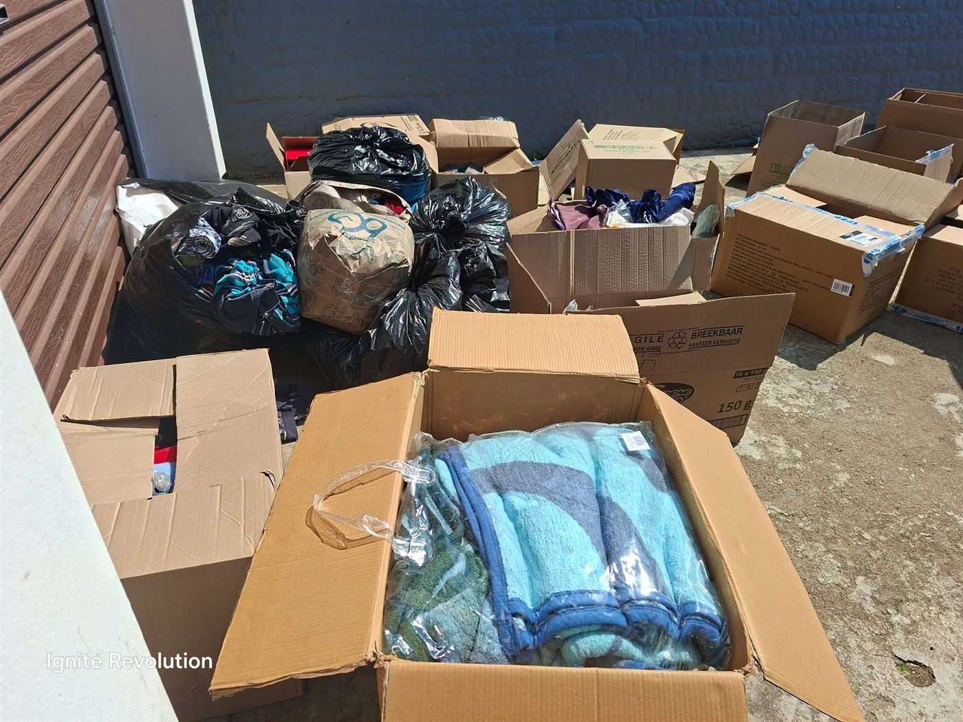Sorting donated clothing and blankets