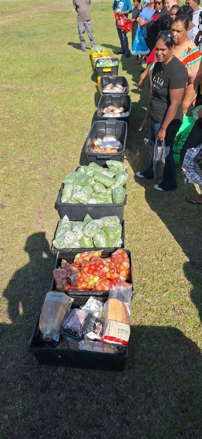 Crates of vegetables and bread